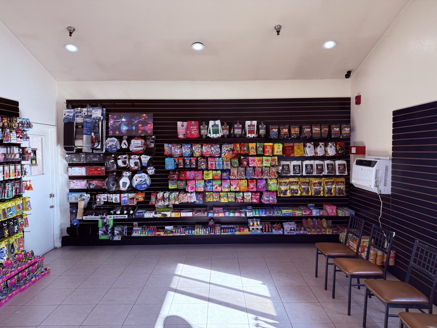 Bench seating along the snack wall inside the Magnolia Car Wash lounge